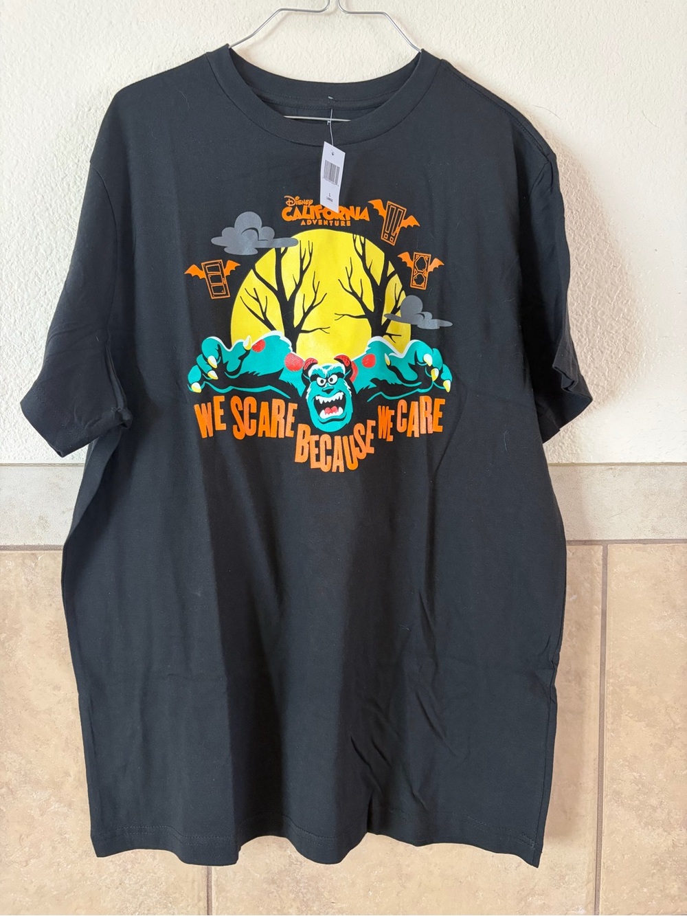Disney Black Tee with Yellow Moon & Teal Monster Graphic
